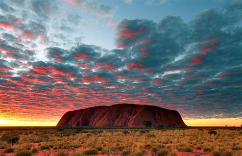 Uluru Or Better Known As Ayers Rock Is A Large Sandstone Rock