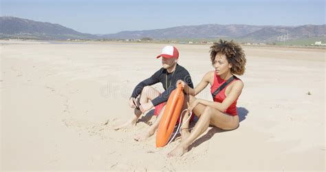 Female And Male Lifeguards Patrolling Beach Stock Image Image Of Lifesaver Seashore 87745739