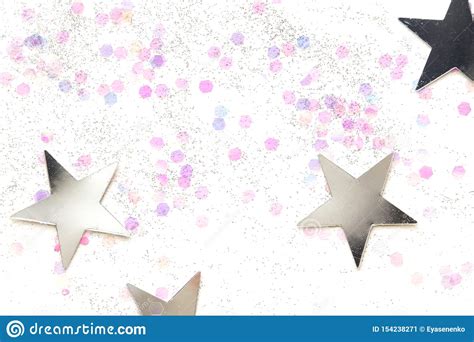 Confetti And Silver Stars On A White Background Festive Concept Stock