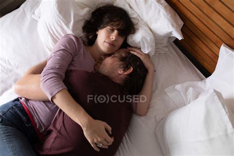 Front View Close Up Of A Young Caucasian Man And Woman Sleeping And