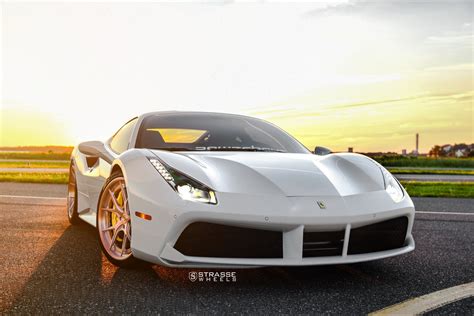 The 488 ushered in a new age for ferrari when the turbocharged 488 gtb replaced the naturally aspirated 458. White Ferrari 488 Stands Out with Rose Gold Strasse Wheels on — CARiD.com Gallery