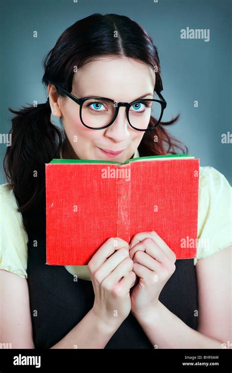 Geeky School Girl Looks Over Red Book Stock Photo Alamy