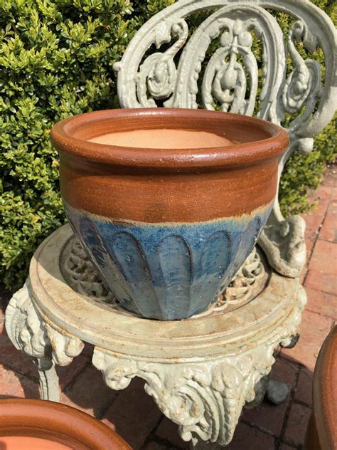 Painting terracotta pots is a fun way to add color to your home or garden. Semi-Glazed Bulbous Terracotta Blue Planters