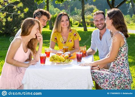 Group Of Friends Enjoying Outdoor Picnic In Park Stock Image Image Of