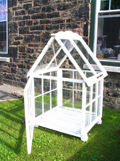 Measure and plan carefully before attaching windows. fancy Greenhouse From Old Windows | Window Greenhouse | Window greenhouse, Old window greenhouse ...