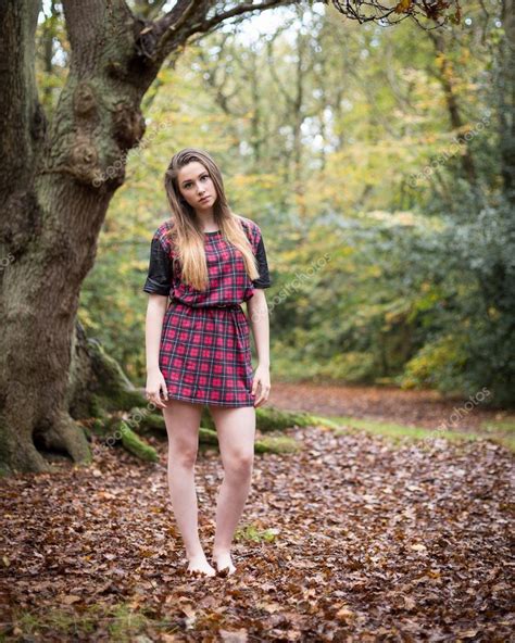 Portrait Of A Beautiful Teenage Girl Standing In A Forest Stock Photo Heijo
