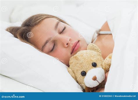 Cheerful Girl Sleeping With Her Teddy Bear Stock Image Image Of Duvet