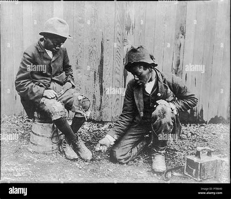 2 African American Shoe Shine Boys Playing Marbles Stock Photo Alamy