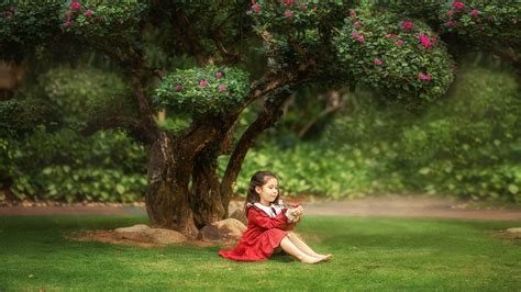 Cute Girl Child With Red Dress Is Sitting Under Blossom Tree Hd Cute