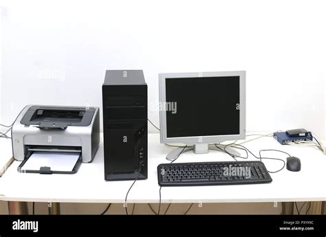 Desktop Computer With Display Keyboard Mouse And Printer On Desk Stock