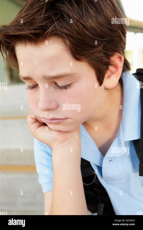 Unhappy Pre Teen Boy At School Stock Photo Alamy