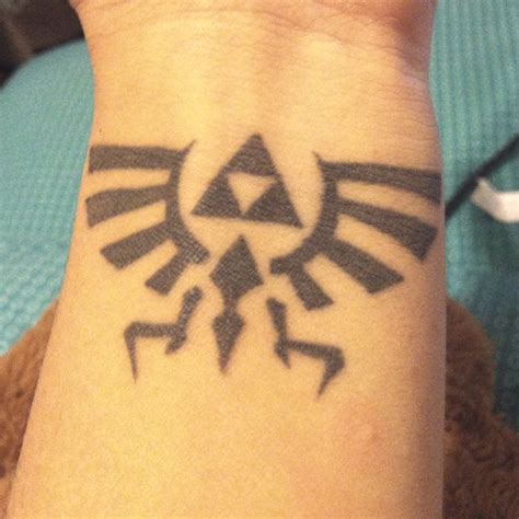 Hylian Crest Wrist Tattoo Id Want The Wings Of Mine To Wrap Around To