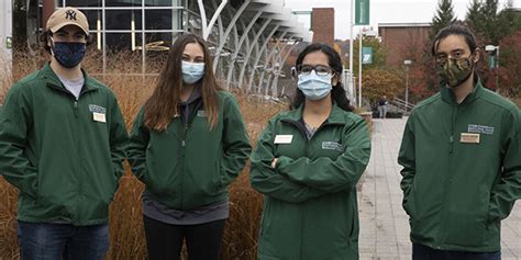 Green Jackets Monitor Campus Public Spaces For COVID Compliance