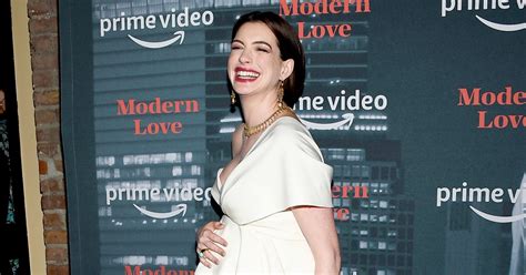 Pregnant Anne Hathaway Cradles Baby Bump On Red Carpet Pics