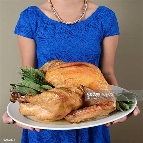 Woman Holding Roast Turkey Photos And Premium High Res Pictures Getty Images