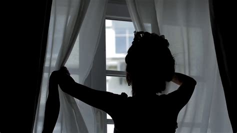 Girl Looks Out Window Woman Opens Curtains Stock Footage Sbv 316829141 Storyblocks
