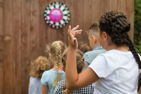 Children Waiting For Their Turn To Play Darts Editorial Photo Image
