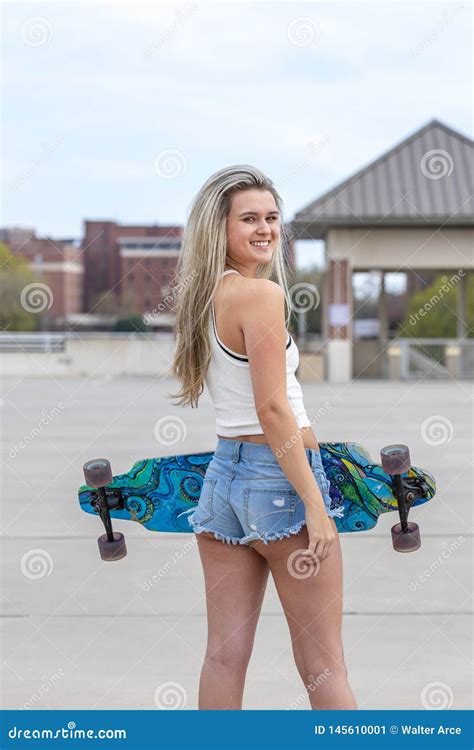 Gorgeous Young Coed Model Enjoying The Warm Weather With Her Skateboard Stock Image Image Of