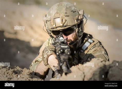Soldier Pointing A Gun Laying Down Stock Photo Alamy
