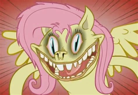 A Cartoon Character With Pink Hair And Big Teeth Is Smiling At The