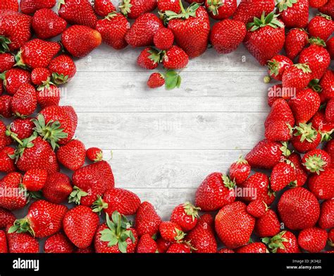 Heart Shaped Made Of Strawberry On White Wooden Background Fruits
