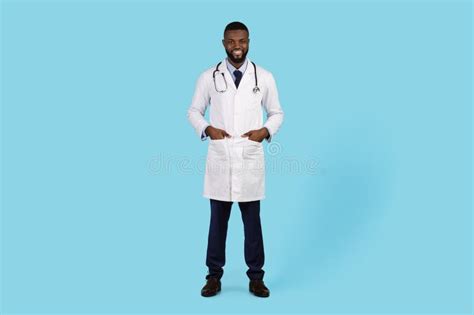 Medical Ad Portrait Of Smiling Young Black Male Doctor In Uniform