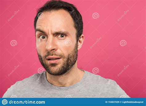 Portrait Of Confused Man Looking At Camera Isolated Stock Image