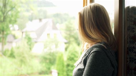 Pensive Woman Looking Through Window At The Country Stock Video Footage Storyblocks