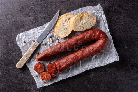 Spanish Chorizo Sausage On Black Slate Background Stock Photo Image