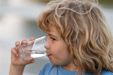 Portrait Of Boy Drinking Glass Of Water Kid Drinking Water Outdoor