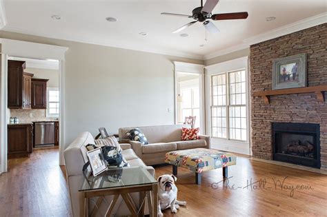 So, our new color is revere pewter by benjamin moore. Family Room with Behr Sculptor Clay and Silky White Trim ...