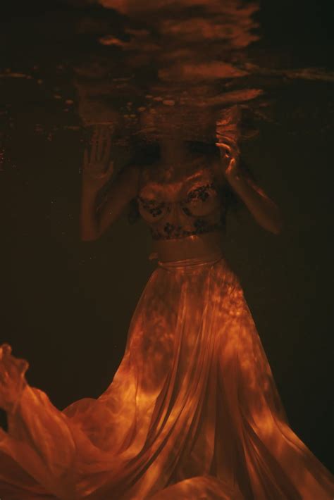 Woman Wearing Sheer Dress Submerged Underwater · Free Stock Photo