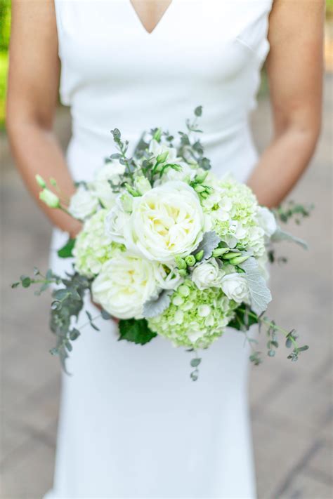 wedding bridal bouquet featuring white hydrangeas roses and greenery photography by chr