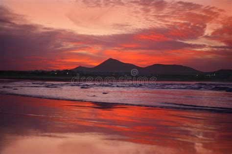 Orange Sunset In Playa Famara Lanzarote Stock Image Image Of Exotic