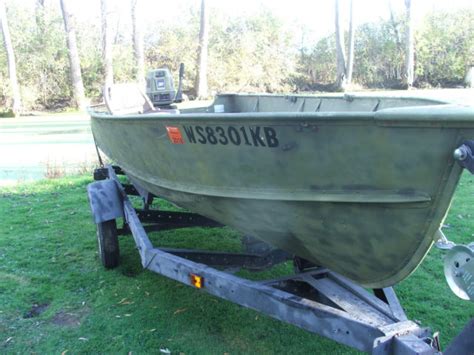 14 Ft Lund Boat And Trailer 30 Hp Evinrude Tiller Outboard Fishing Duck