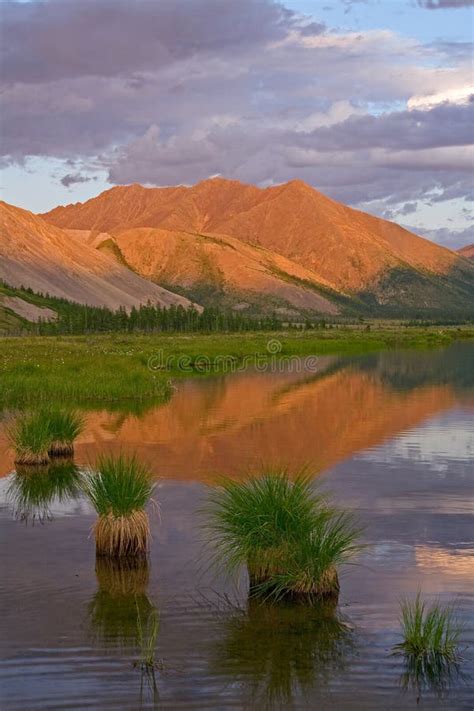 Mountains In Sunset Light And Reflections In The Lake Stock Image