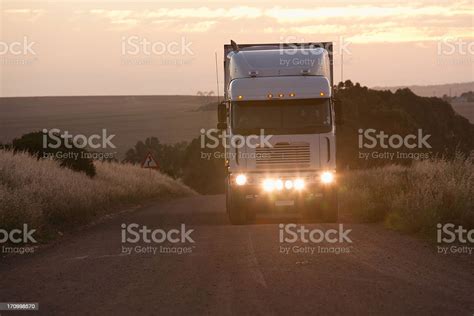 Semitruck Driving In Dirt Road Stock Photo Download Image Now