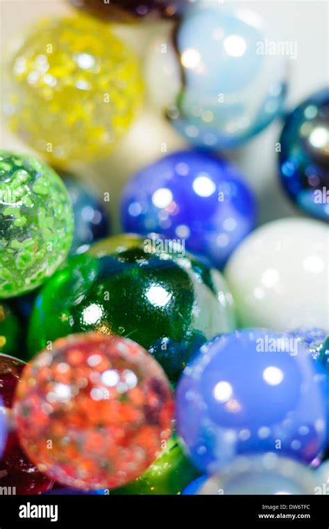 Close Up Of Colorful Glass Marbles In A White Bowl Stock Photo Alamy