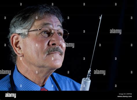 Crazy Doctor With Huge Needle And Syringe Stock Photo Alamy