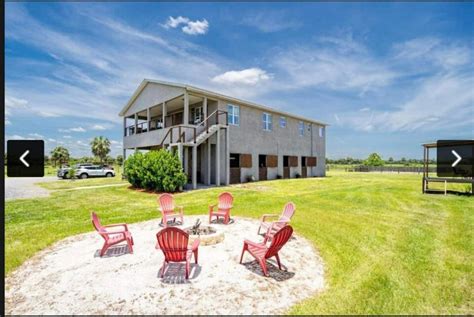 Two Story Florida Barndominium With Lower Level Stables