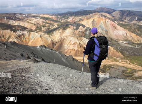 Hiker On The Mountain Of Blahnukur With Colourful Rhyolite Mountains