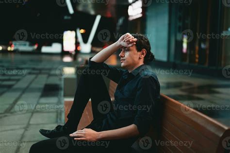 Sad Depressed Man Sitting On A Bench Alone At Night 24753124 Stock