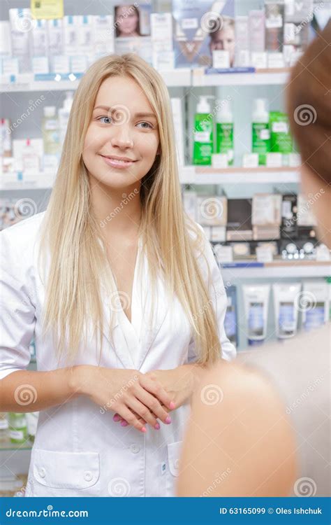 Beautiful Girl Pharmacist Helping A Customer Stock Image Image Of Employee Assistant 63165099