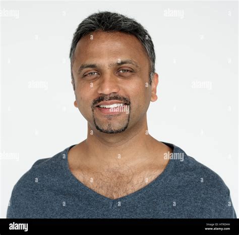 Indian guy smiling cheerful studio portrait Stock Photo - Alamy