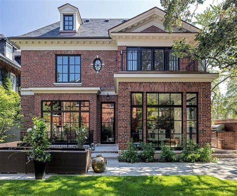 Black Trim Pairs Perfectly With The Modern Brick Exterior Design By