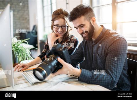 Two Young Designers Working In Modern Office Stock Photo Alamy