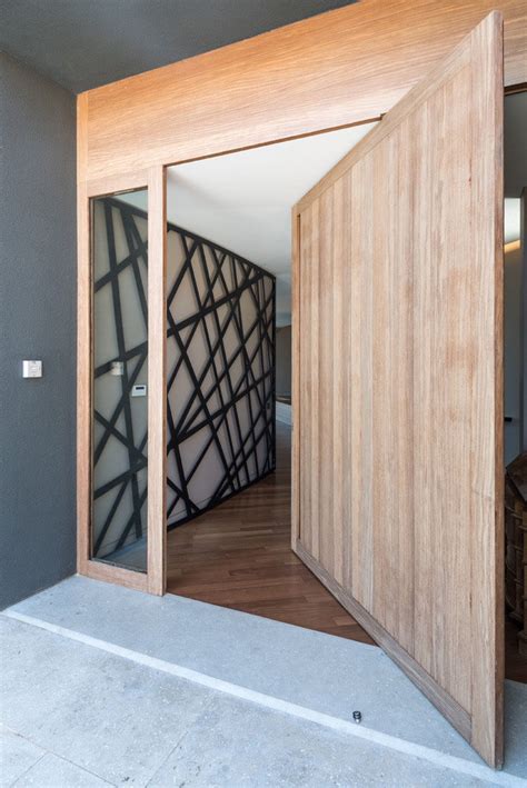These 13 Sophisticated Modern Wood Door Designs Add A Warm Welcome
