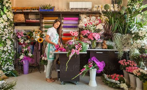 Florist Working In Her Flower Shop By Stocksy Contributor Mosuno