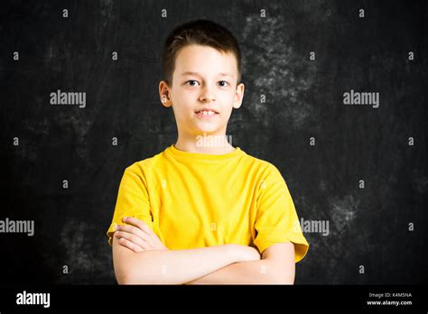 Portrait Of Teenage A Boy Against Dark Background Stock Photo Alamy