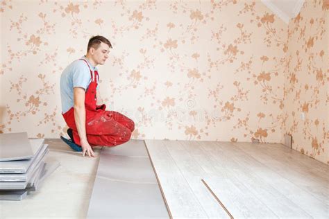 Handyman Laying Down Laminate Flooring Boards Stock Photo Image Of